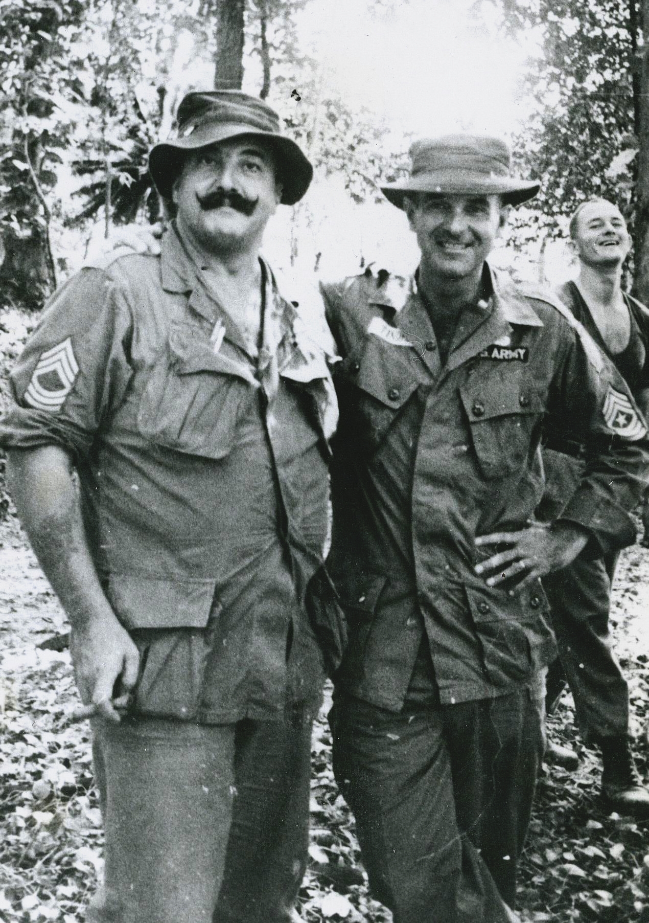 MSG Greald N. \'Moose\'Brannon, SGM Rush R. Tindell, and SGT Louis I. Holmes, building B-430 Special Forces Camp in the rain forrest of Trang, South Thailand. November 1966