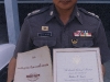 Royal Thai Police Commander, Lt Colonel, holding a copy of our book, Counterinsurgency Training for Police Officers, and a copy of a letter from President George Bush I, regarding the death of SSG Wallace Gumbs