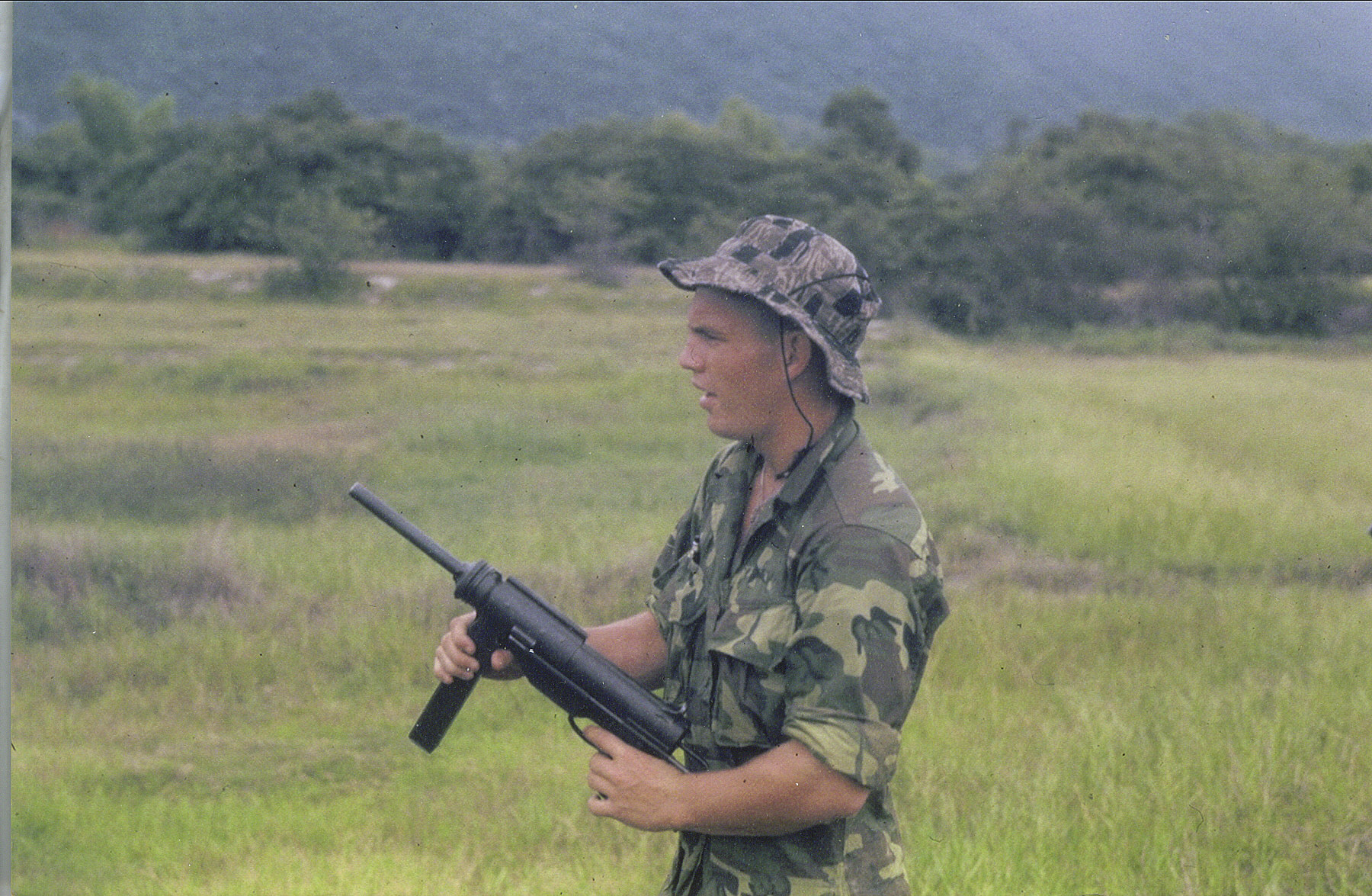 Sgt Mark Miller with M3A1 45 cal greese gun RVN