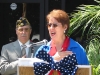 Post Secretary Bonny Jacobs sings the National Anthem