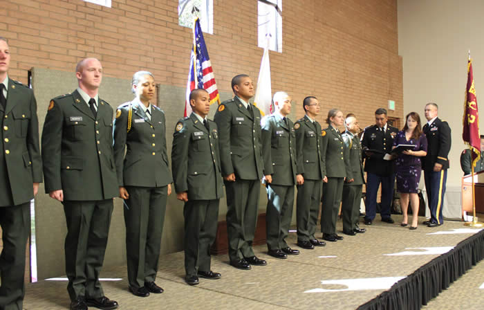 10 members of the USC ROTC Battalion on stage for awards. LTC Robert F. Huntly, Commanding Officer, to right. 10 members of the USC ROTC Battalion on stage for awards. LTC Robert F. Huntly, Commanding Officer, to right.