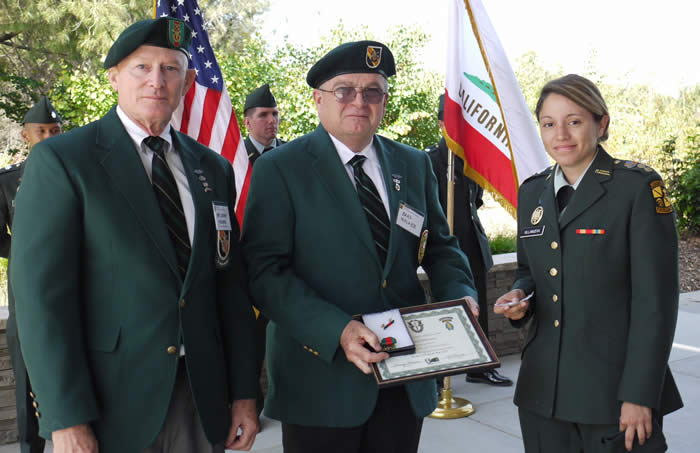 Lonny Holmes, Brad Welker, CSU Fullerton Cadet Jessica Villanueva.