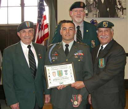 Chapter 78 members (l to r) Richard Simonian, Vice President, Jim Duffy, Asst. Vice President, and Terry Cagnolatti, Treasurer present the ROTC award to Cadet Sergeant Enrique Monreal.