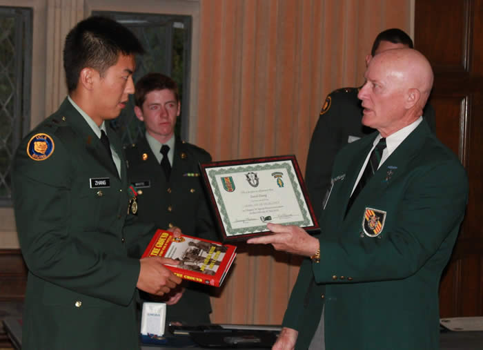 University of California at Los Angeles ROTC Battalion Professor of Military Science LTC David Kramer, Commanding - Cadet David Zhang, Lonny Holmes presenting certificate.