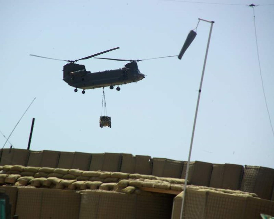 CH-47 (from Flipper unit at KAF) delivers usable vehicle to ODA-725 and ODA-726 at FOB Rob, Sangin, after one of their vehicles “shot to shit” in ambush during Chinook shootdown op. (Courtesy SOTF -71)
