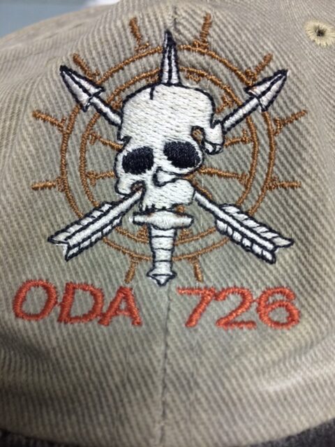 IMG_4464 The ODA 726 logo stitched on Joff’s baseball cap from downrange, which he’d given to Alex. He’d written the names of fallen SF brothers on the inside of the cap.