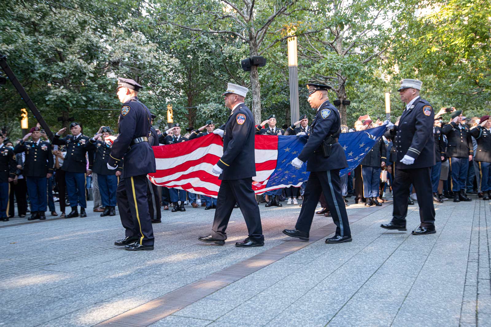 FDNY and NYPD open 9/11 ceremony carrying US flag