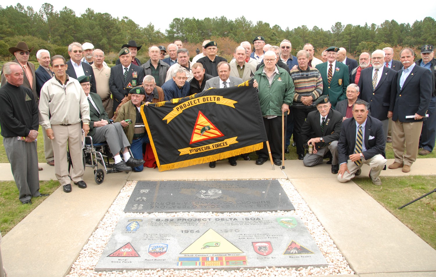 Project Delta Veterans at memorial stone placed in their honor at USASOC headquarters.