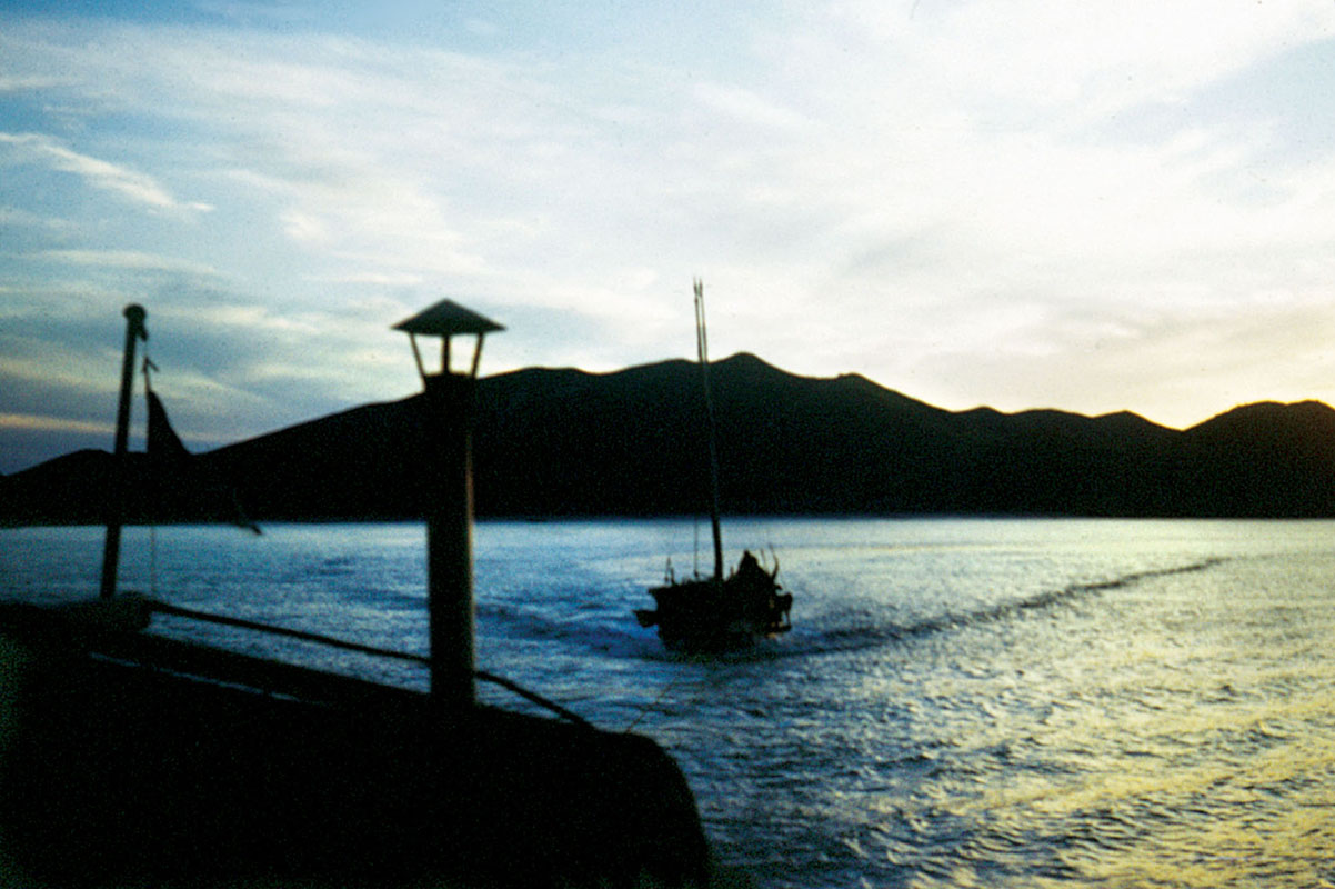 Towing a sailing junk. Often one motorized junk would tow three sailing junks on an operation. (U.S. Army)