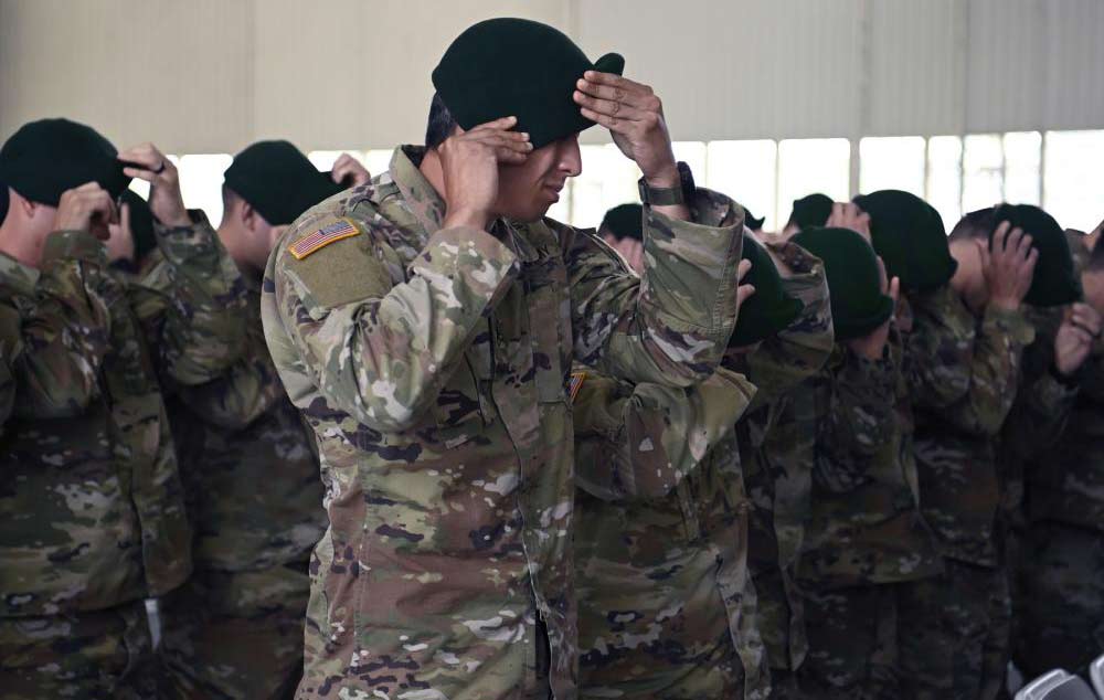 Soldiers don their green berets for the first time. (U.S. Army photo by K. Kassens)