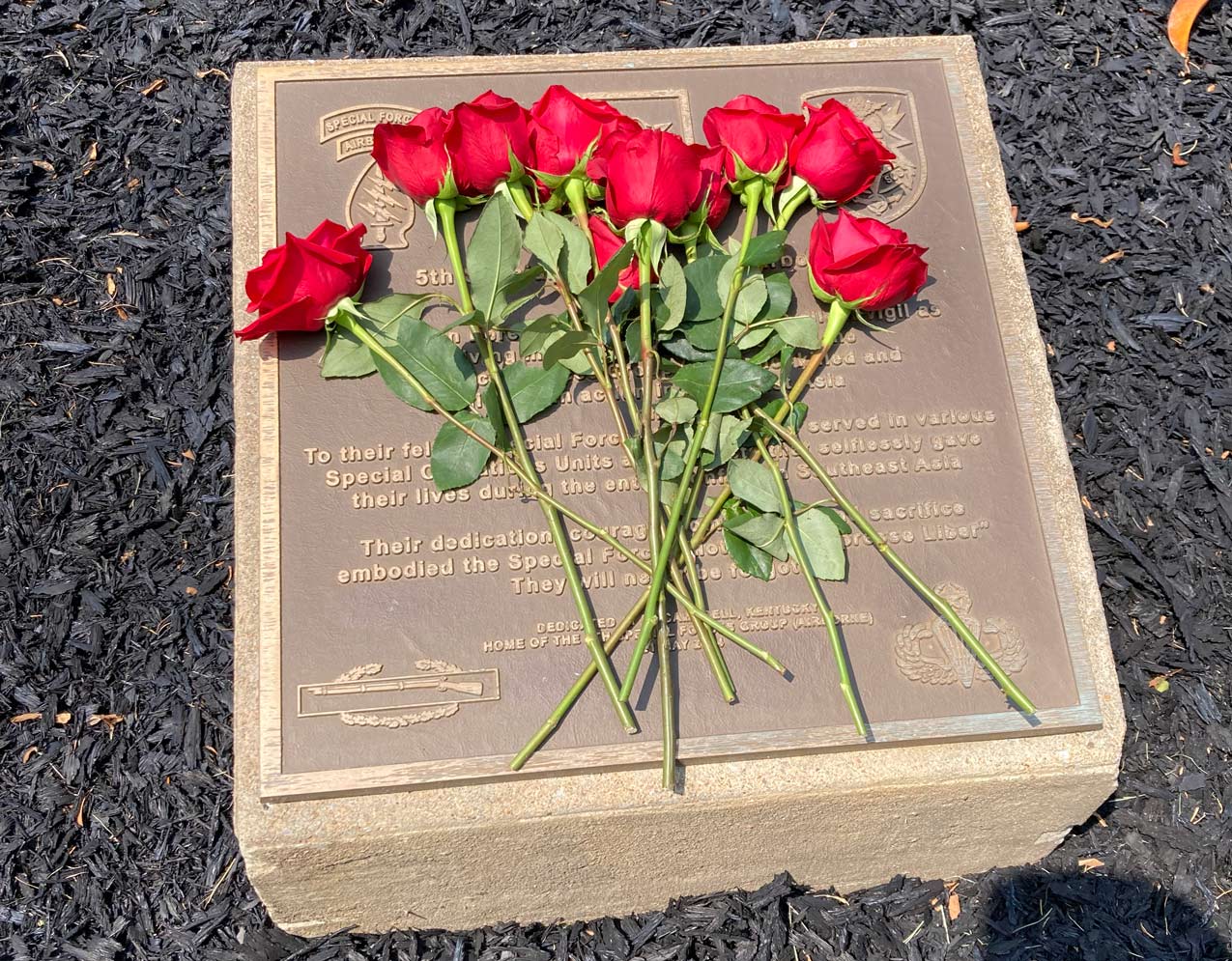 Roses were placed on the memorial by Sternberg, Godshall, and Meyer during the ceremony for the 5th SFG Vietnam Memorial.