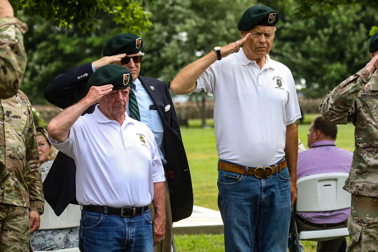 George Sternberg, Doug Godshall, and John Stryker Meyer saluting the newly unveiled 5th SFG Vietnam Memorial at 5th Grp HQ on Gabriel Field.