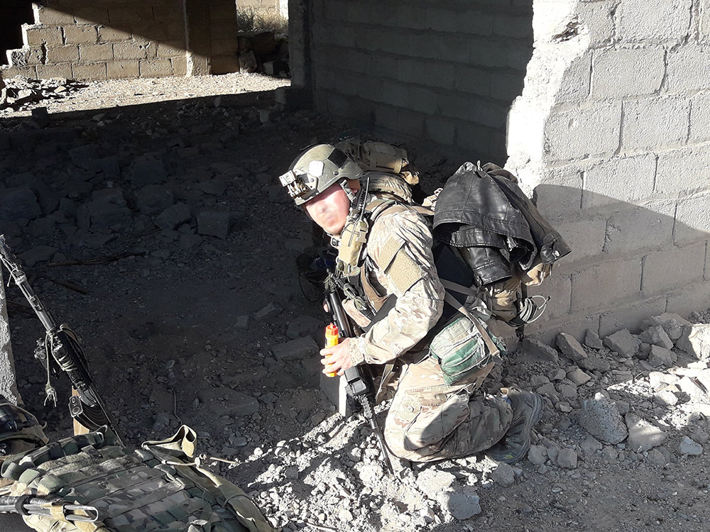 KH entering a structure to uncover ied