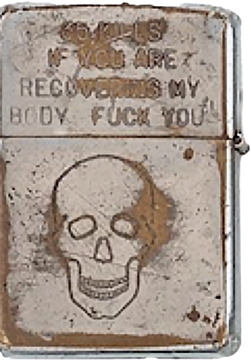 Old lighter engraved with the image of a skull and the words "65 KILLS IF YOU ARE RECOVERING MY BODY FUCK YOU