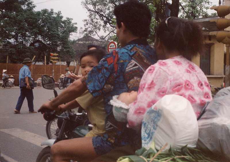 A family on a motorcycle, Hanoi (Photo by Marc Yablonka)