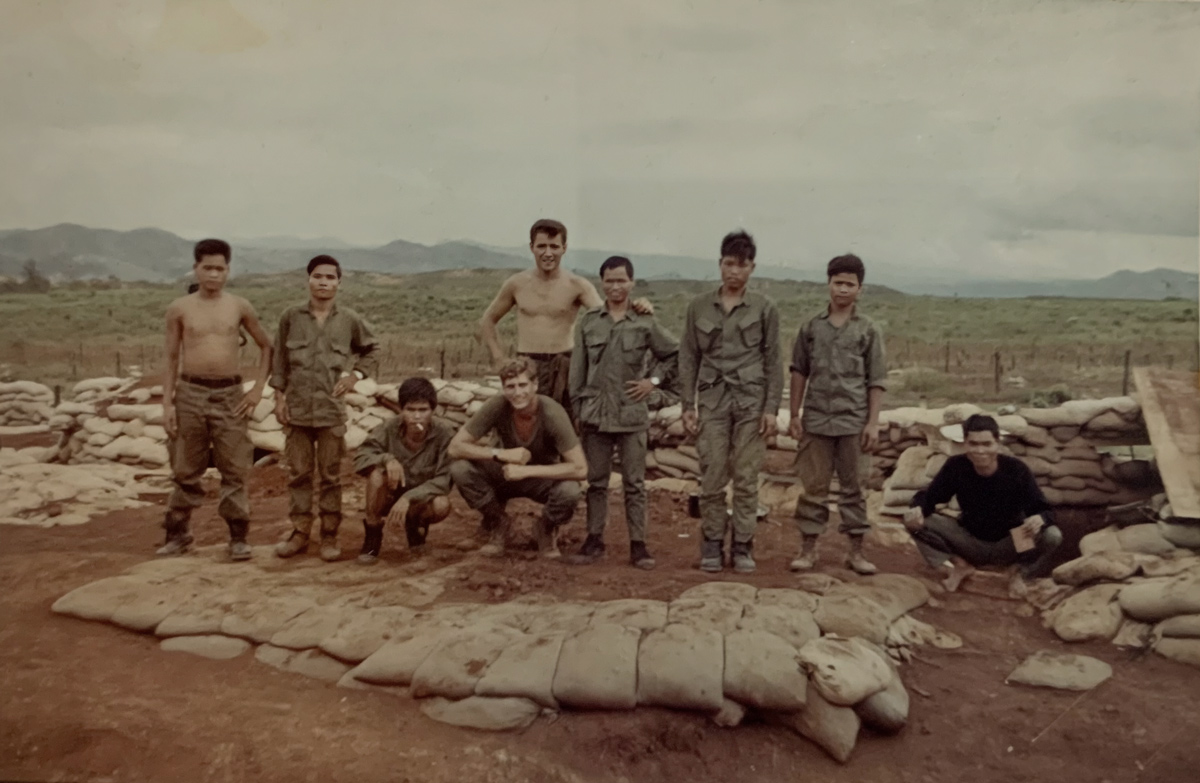 A group shot of my Spike team at FOB 3. Henry King is the other American crouching in the front of the group. (Photo by Robert Shippen, courtesy Denis Chericone)