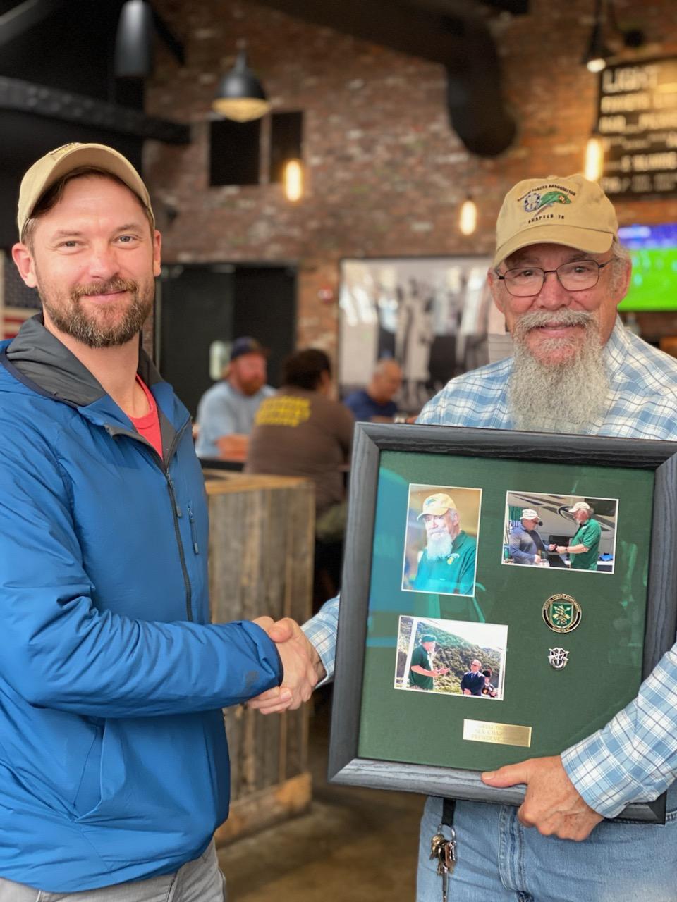 SFA Chapter 78 Vice President James McLanahan present plaque to past Chapter 78 president Greg Horton.