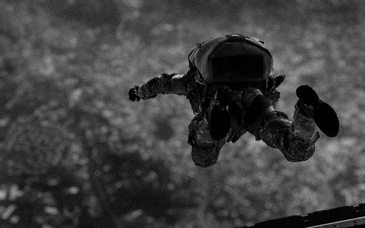 U.S. airmen and soldiers parachute off an MC-130J Commando II above Kadena Air Base, Okinawa, April 24, 2017. (John Linzmeier/U.S. Air Force)